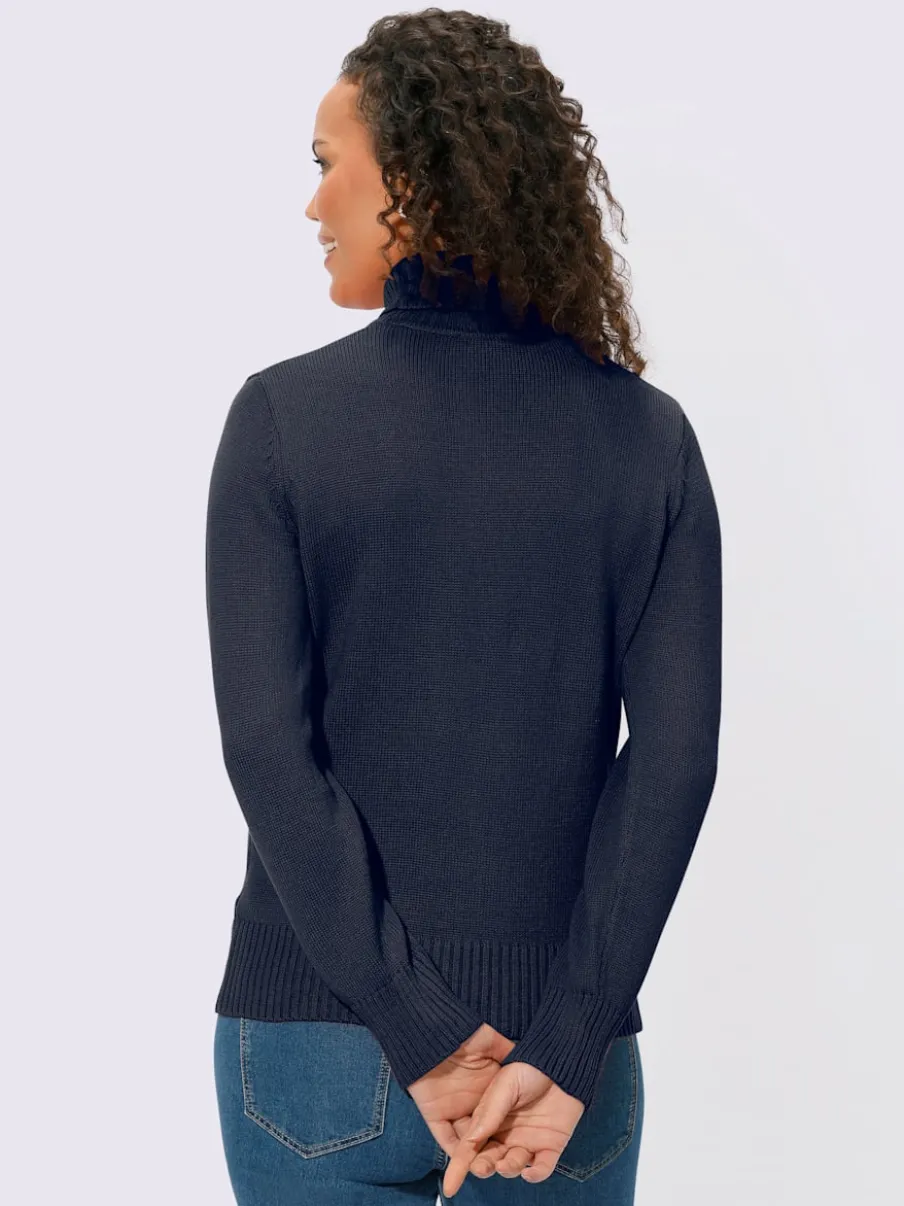 Pull col roulé à emmanchures diminuées finitions côtelées