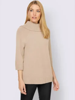 Pull col roulé à manches 3/4 avec fente latérale