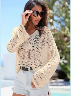Pull de plage encolure en V avec manches longues et motif ajouré transparent