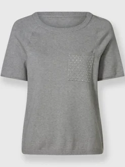 Pull doux avec poche poitrine et manches courtes roulottées