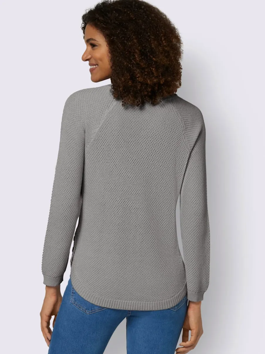 Pull encolure ronde à manches longues avec boutons décoratifs et finitions côtelées