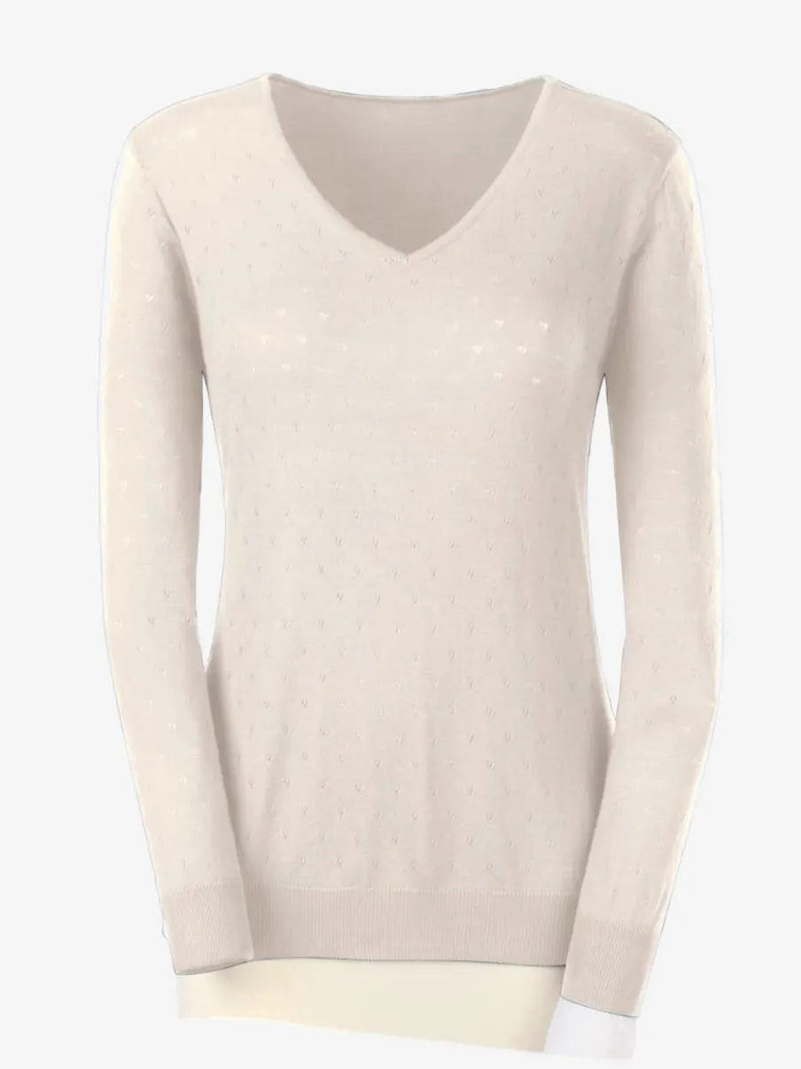 Pull en tricot doux col en V motif ajouré.