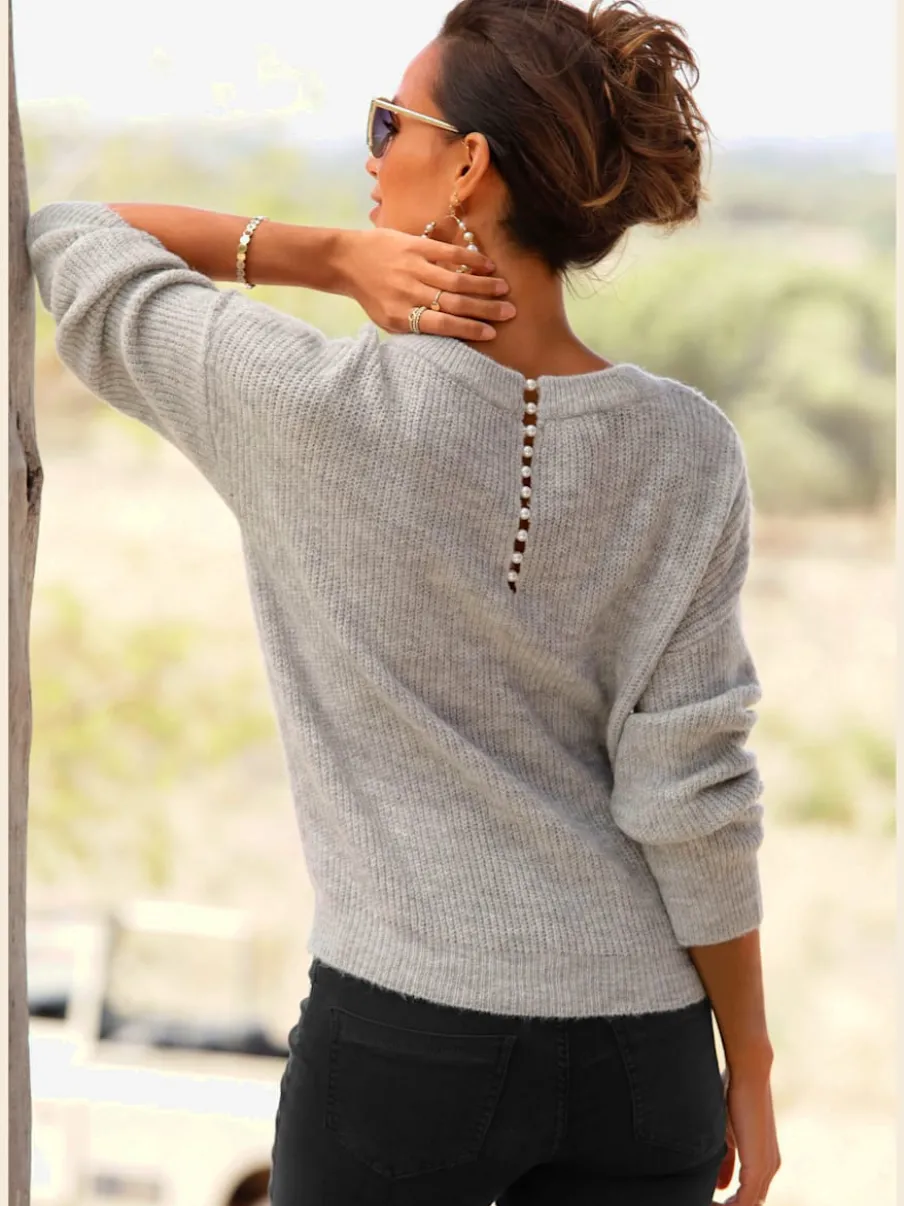 Pull en tricot à encolure en V avec perles et fente au dos