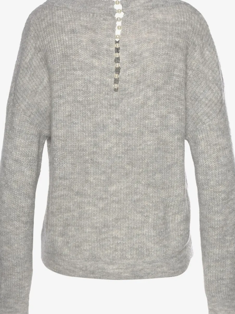 Pull en tricot à encolure en V avec perles et fente au dos