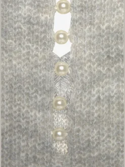 Pull en tricot à encolure en V avec perles et fente au dos