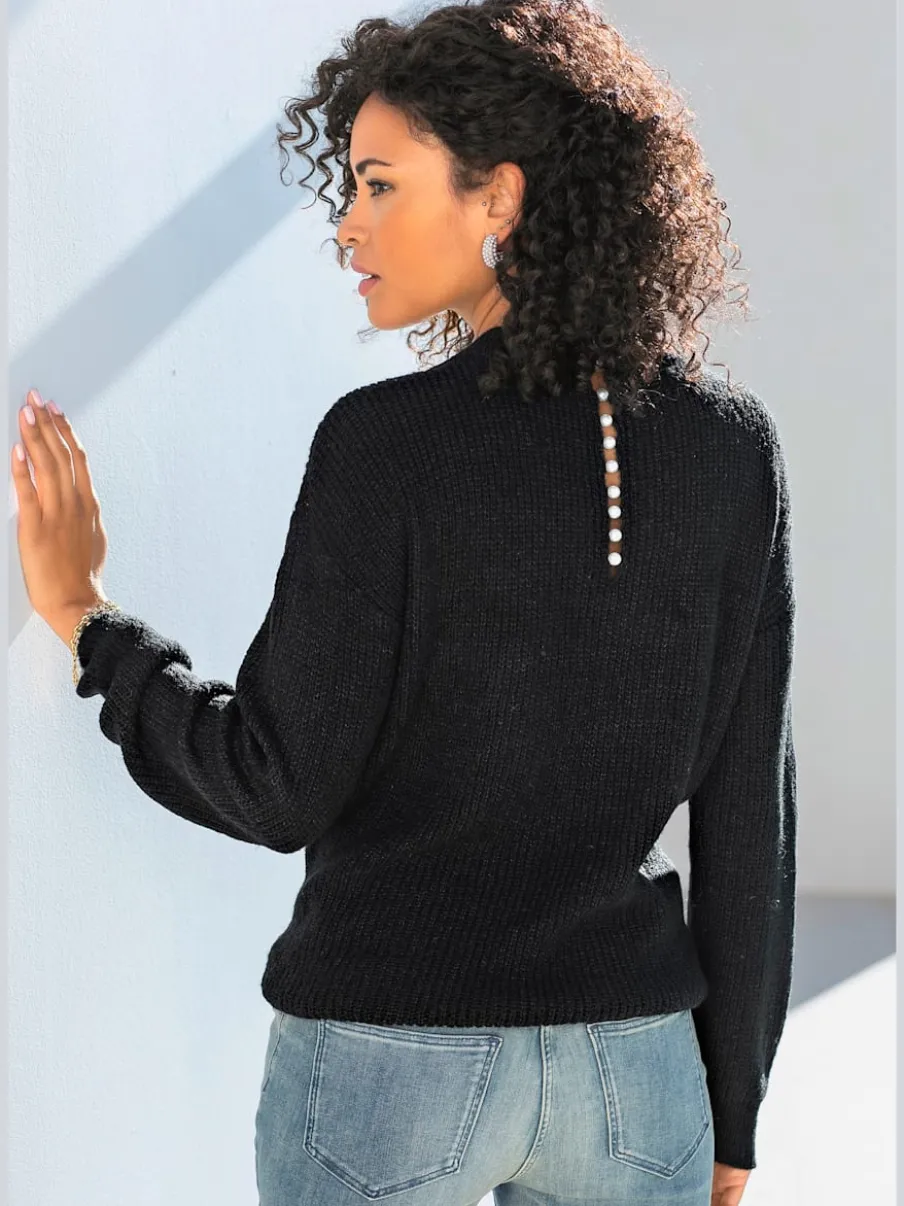Pull en tricot à encolure en V avec perles et fente au dos