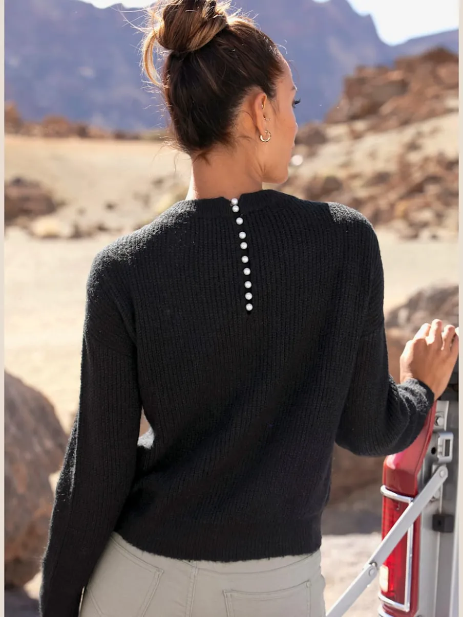 Pull en tricot à encolure en V avec perles et fente au dos