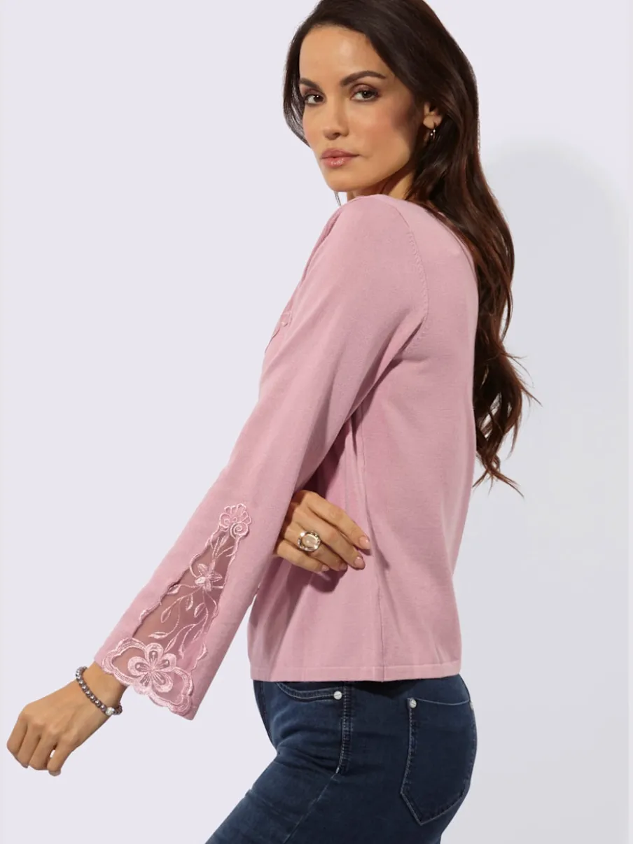 Pull en tricot fin avec encolure V et manches évasées ornées de dentelle