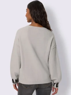 Pull en tricot à inscriptions devant et sur les manches longues avec encolure ronde et bords-côtes