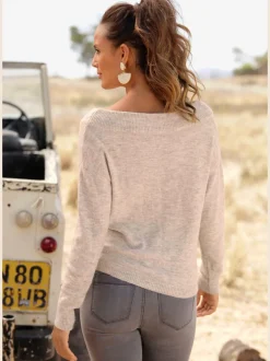 Pull en tricot léger avec col bateau et nœud à l'ourlet