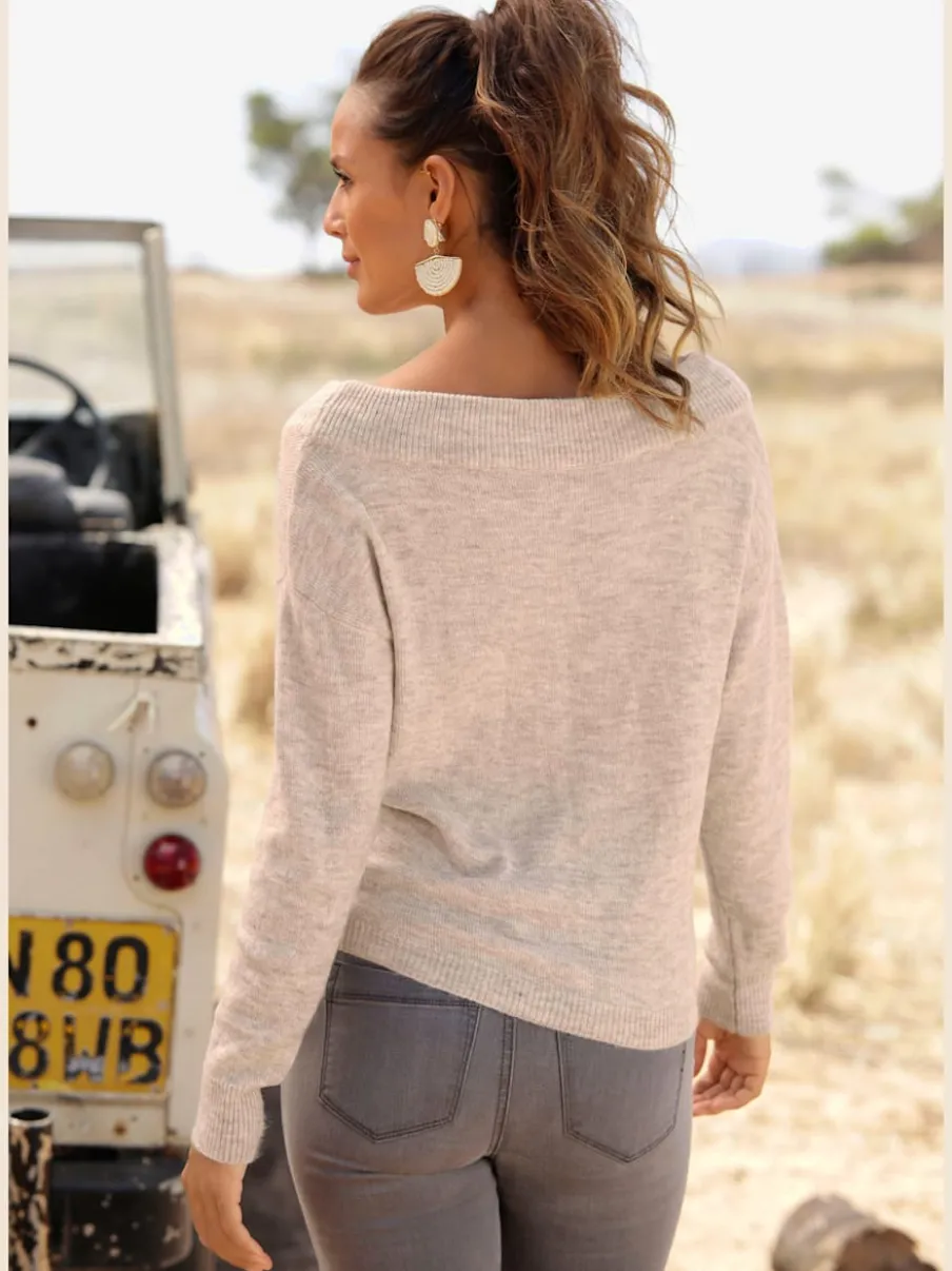 Pull en tricot léger avec col bateau et nœud à l'ourlet