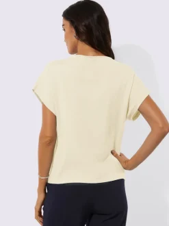 Pull à fleurs et découpes avec encolure en U