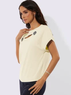 Pull à fleurs et découpes avec encolure en U