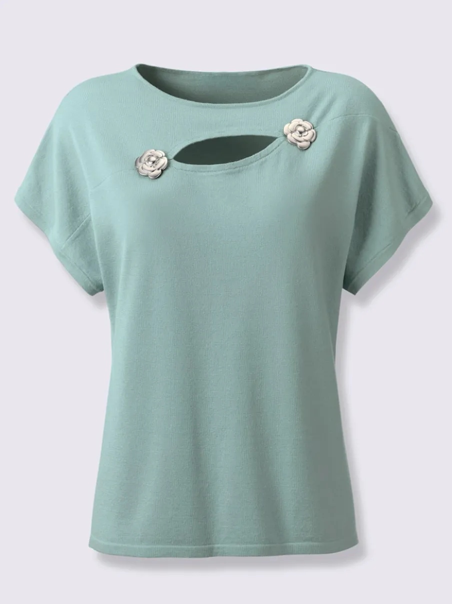 Pull à fleurs et découpes avec encolure en U
