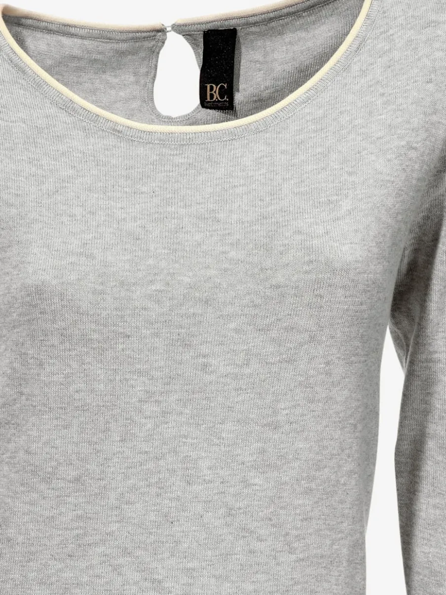 Pull long à col rond et manches longues avec poche sur le devant et découpes au dos