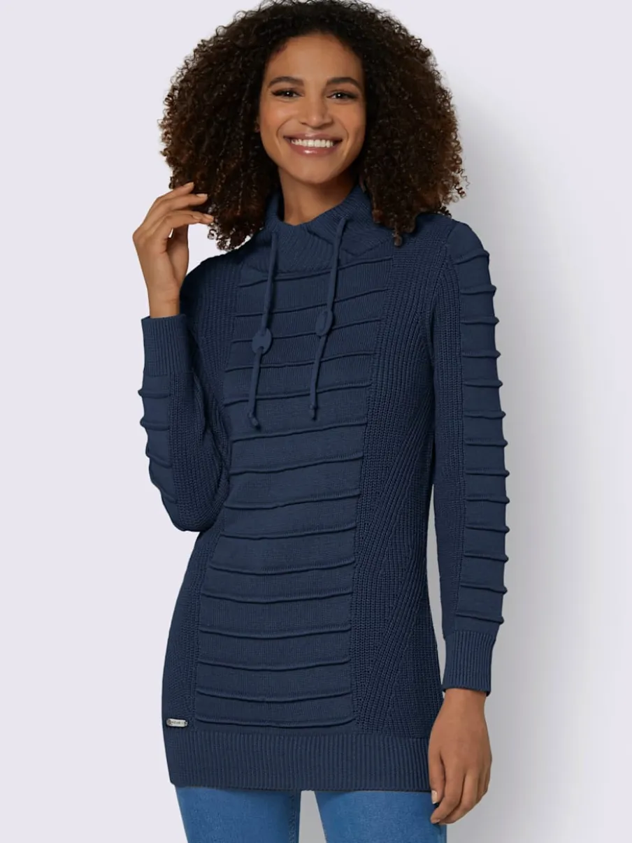 Pull long col roulé manches longues motif structuré moderne