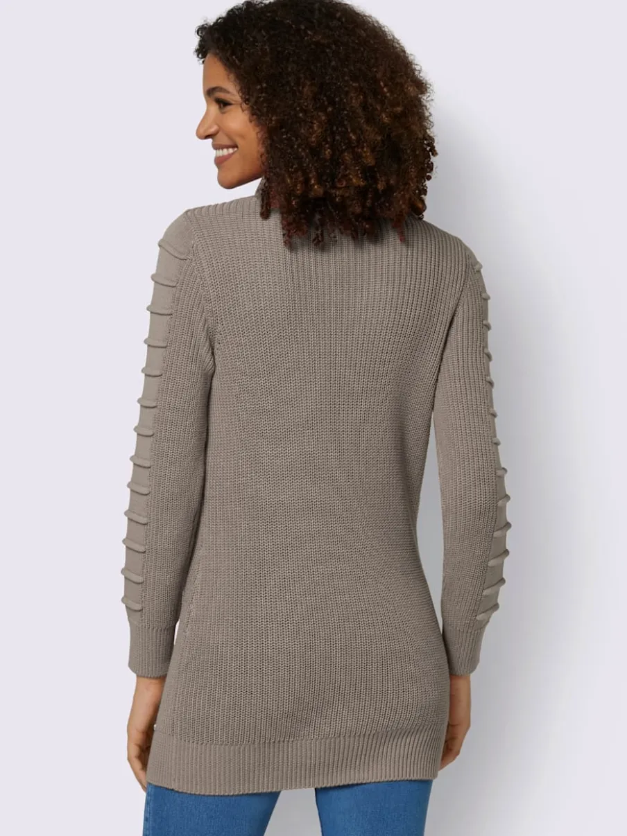 Pull long col roulé manches longues motif structuré moderne
