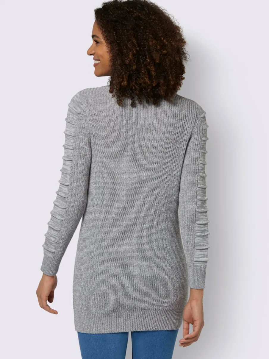 Pull long col roulé manches longues motif structuré moderne