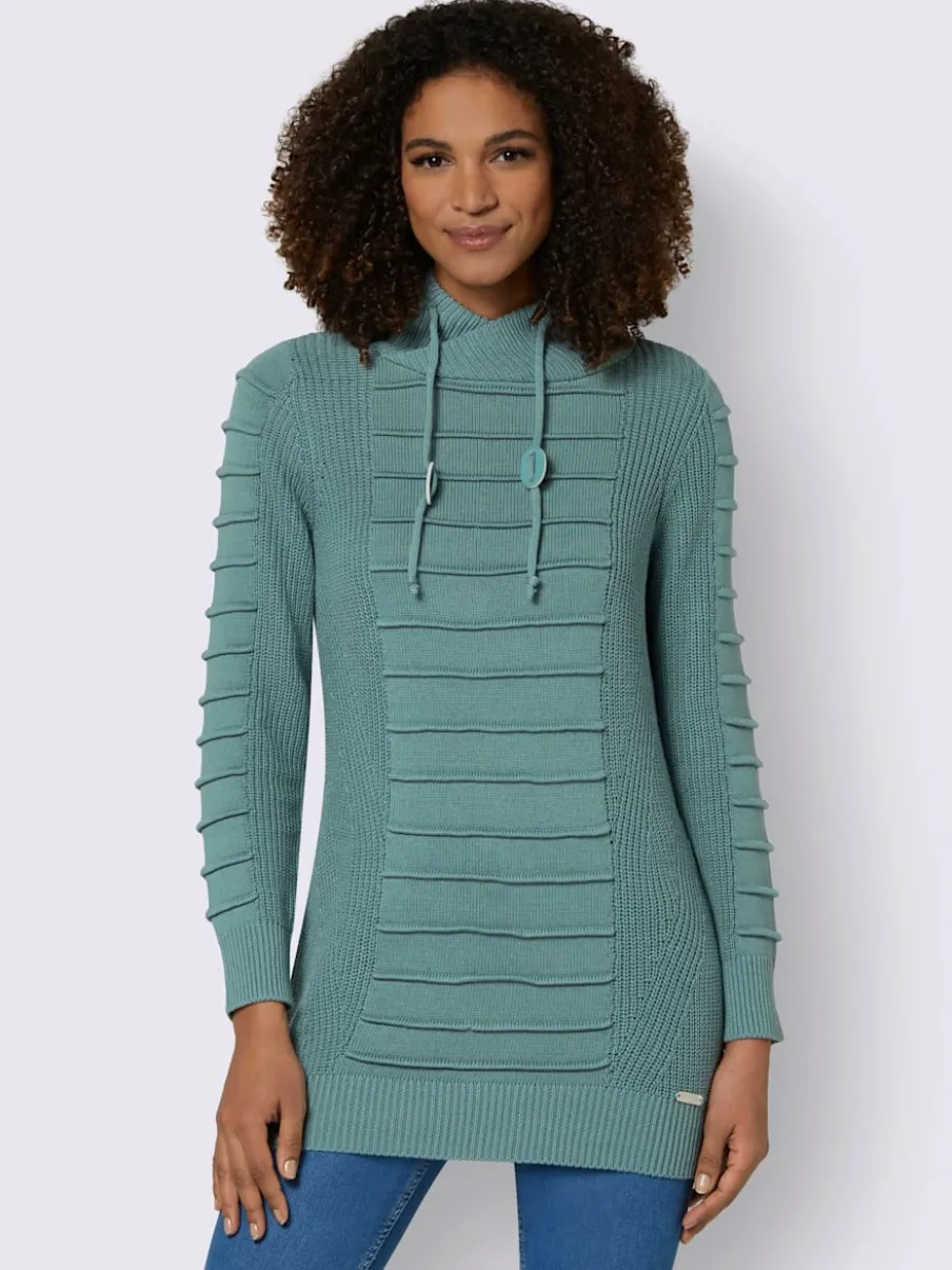 Pull long col roulé manches longues motif structuré moderne
