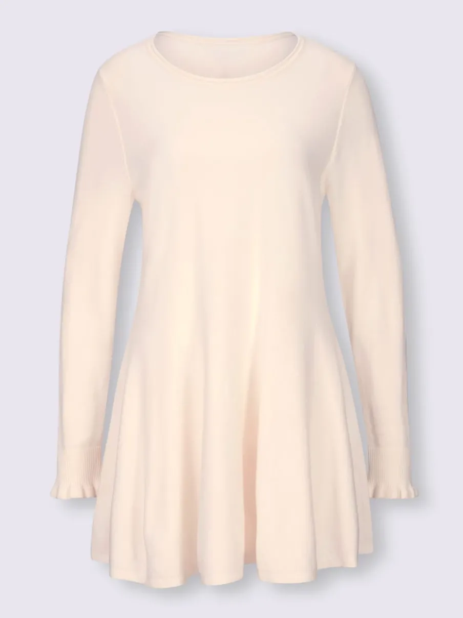 Pull long légèrement évasé avec bords roulés et volants