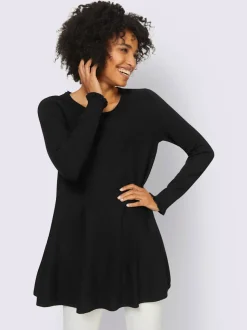 Pull long légèrement évasé avec bords roulés et volants