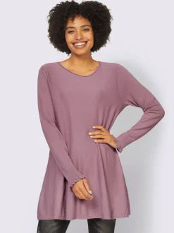 Pull long légèrement évasé avec bords roulés et volants