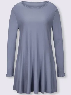 Pull long légèrement évasé avec bords roulés et volants