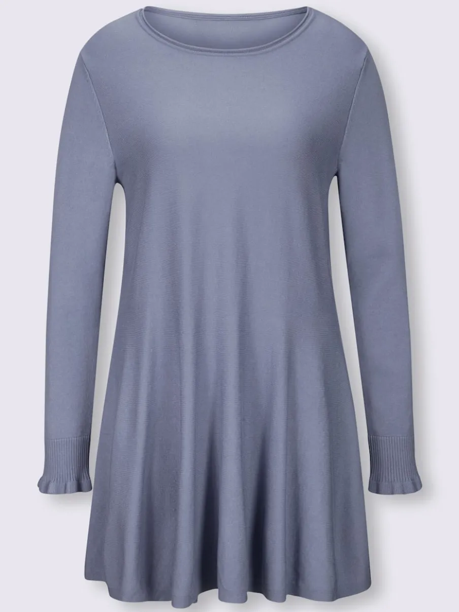 Pull long légèrement évasé avec bords roulés et volants