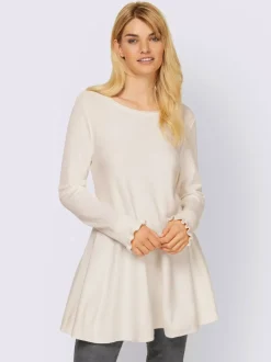 Pull long légèrement évasé avec bords roulés et volants