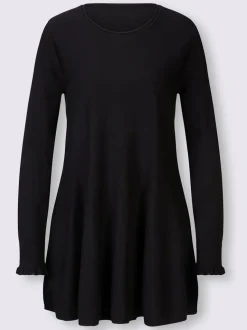 Pull long légèrement évasé avec bords roulés et volants