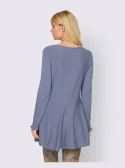 Pull long légèrement évasé avec bords roulés et volants