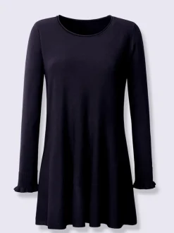 Pull long légèrement évasé avec bords roulés et volants
