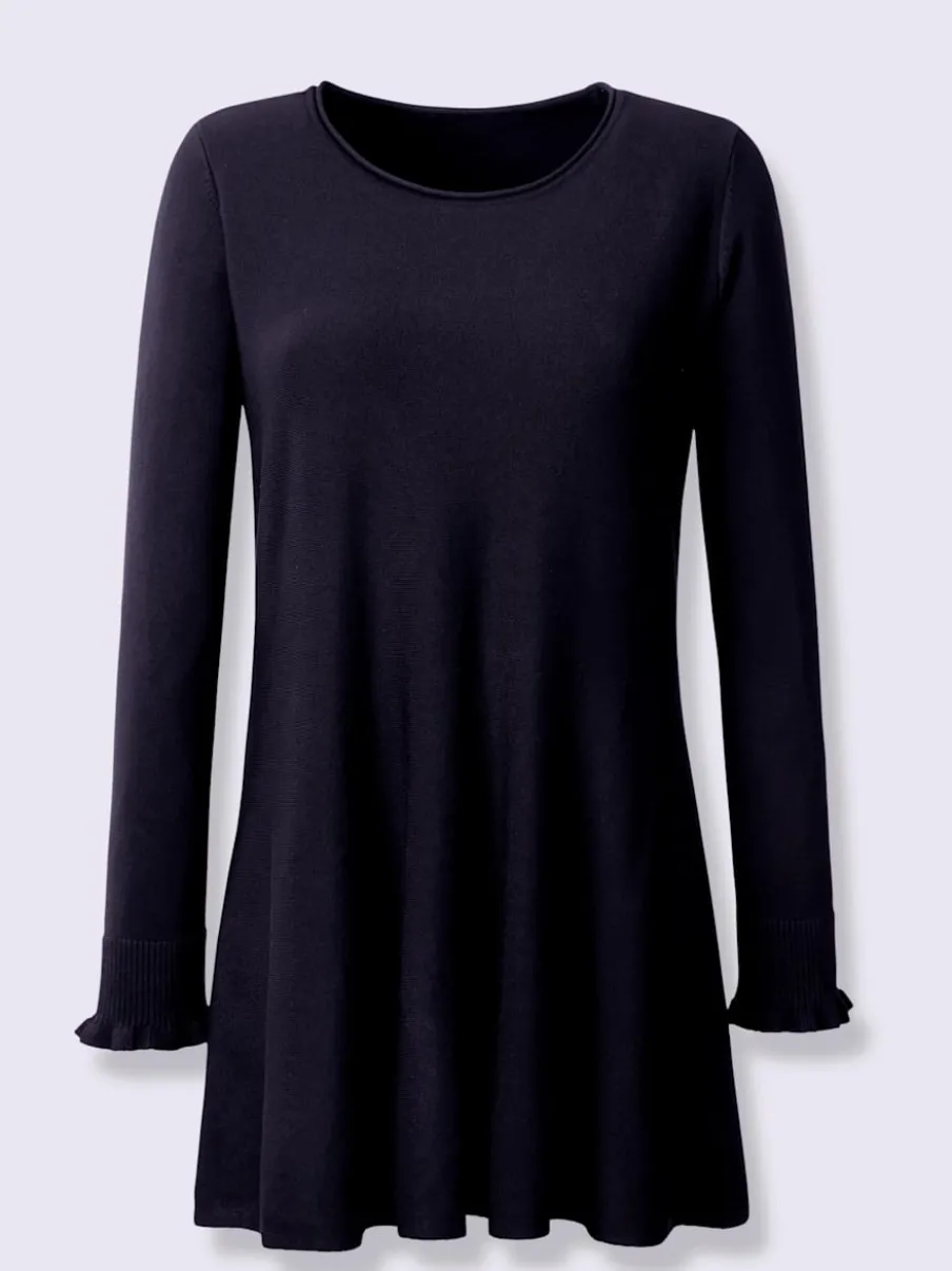 Pull long légèrement évasé avec bords roulés et volants