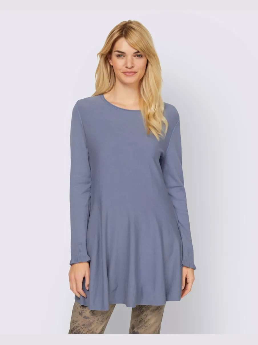 Pull long légèrement évasé avec bords roulés et volants