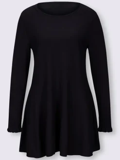 Pull long légèrement évasé avec bords roulés et volants
