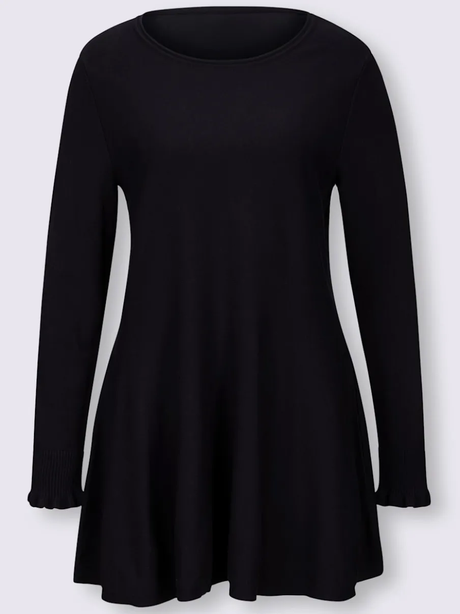 Pull long légèrement évasé avec bords roulés et volants