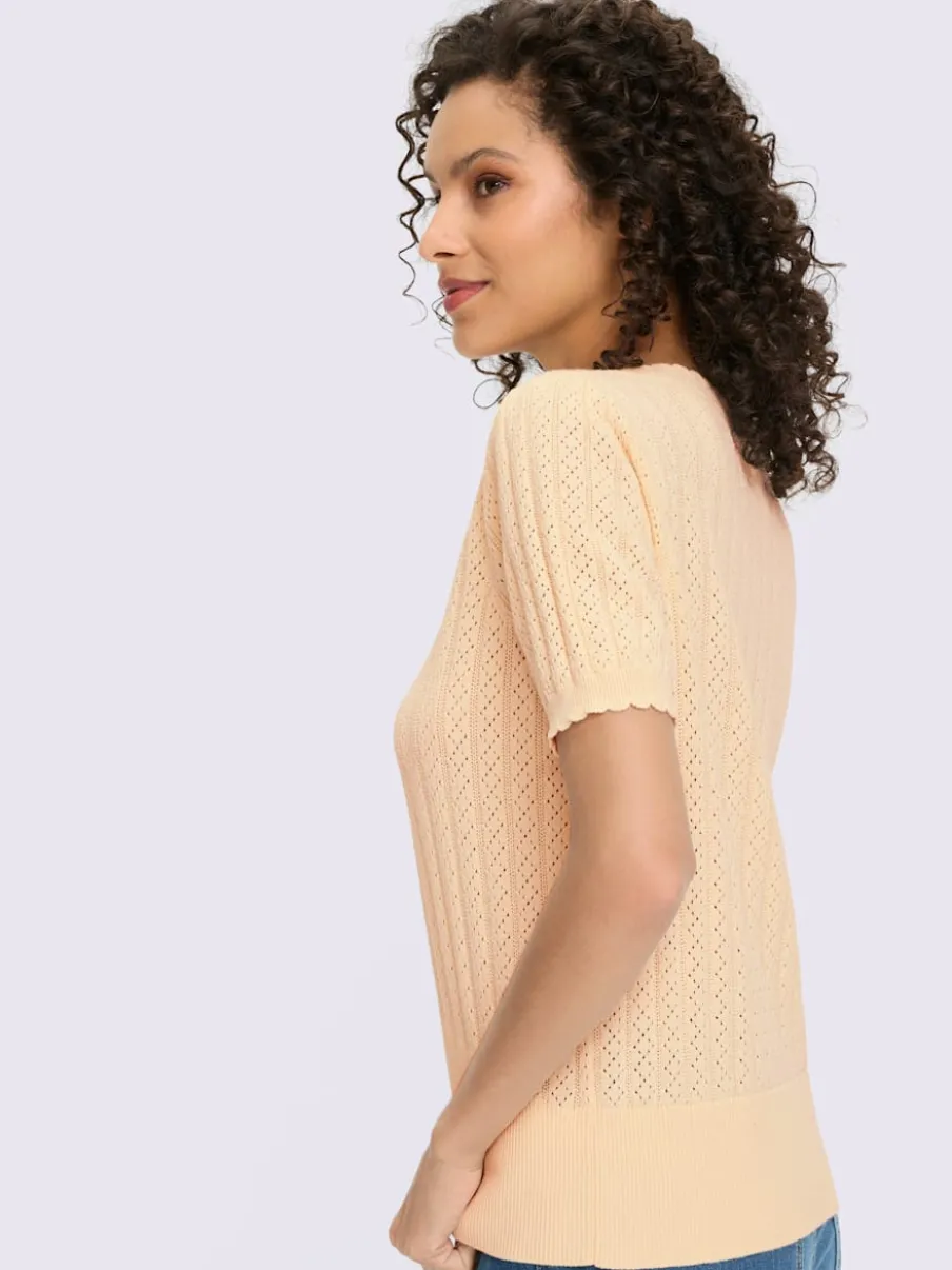 Pull à manches courtes avec motif ajouré et bord ondulé