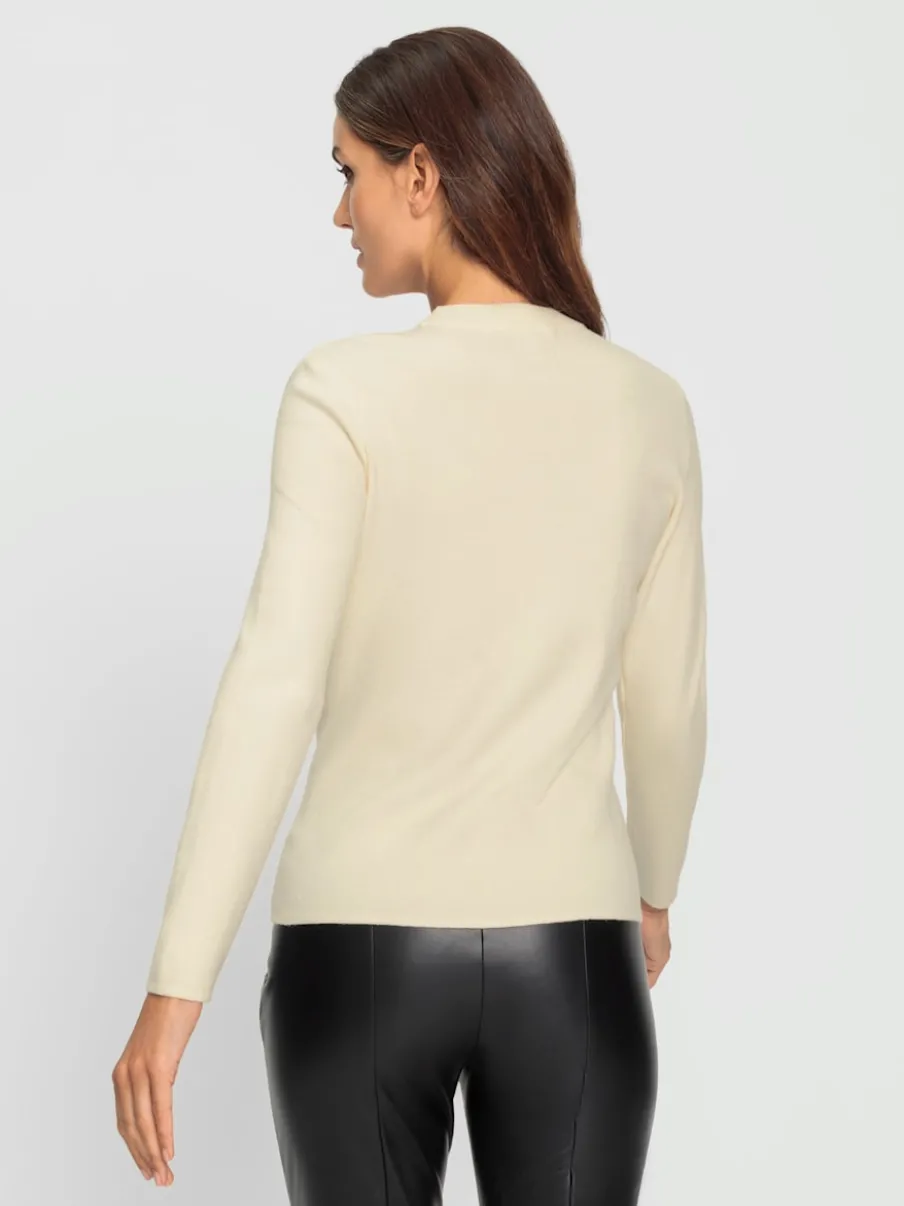 Pull à manches longues avec découpes raffinées à l'encolure