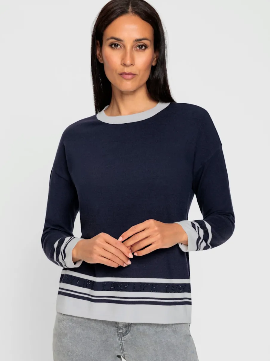 Pull à manches longues avec inscription en pierres brillantes