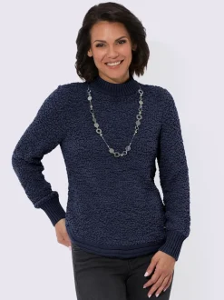 Pull tricoté doux avec col montant et finitions côtelées
