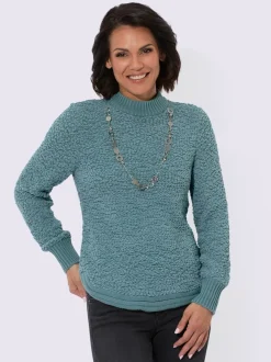 Pull tricoté doux avec col montant et finitions côtelées