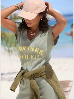 Robe de plage encolure avec bords-côtes légèrement brillants grâce au fil lurex