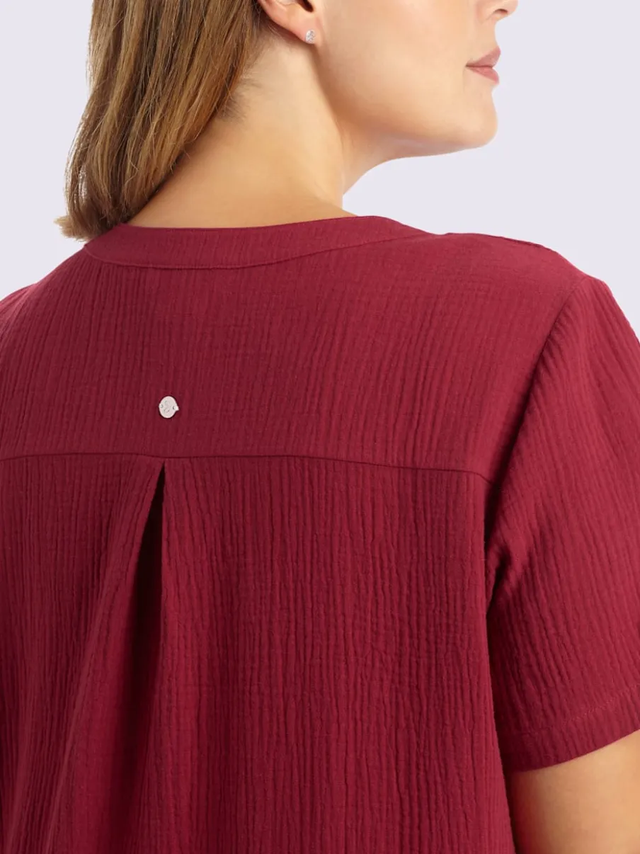 Robe en coton col v avec patte de boutonnage