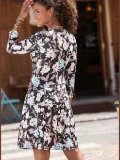 Robe en jersey à encolure en V et manches 3/4 avec nœud devant et motif floral
