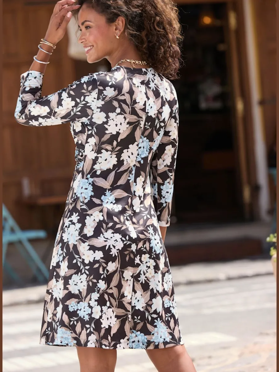 Robe en jersey à encolure en V et manches 3/4 avec nœud devant et motif floral