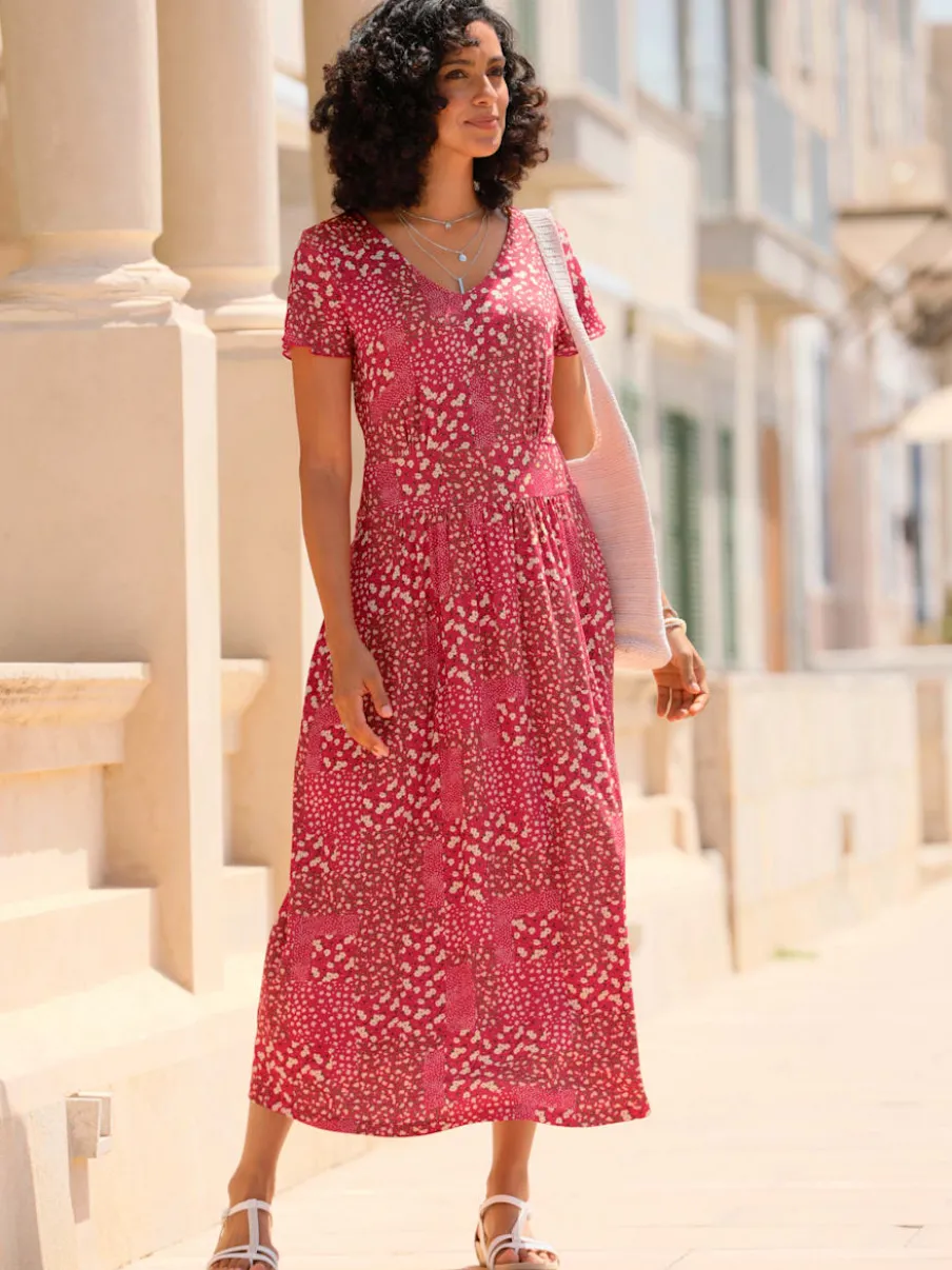 Robe en jersey fluide avec empiècements et manches chauve-souris