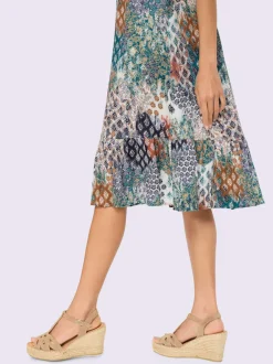 Robe imprimée à col en V avec manches courtes et ourlet volanté