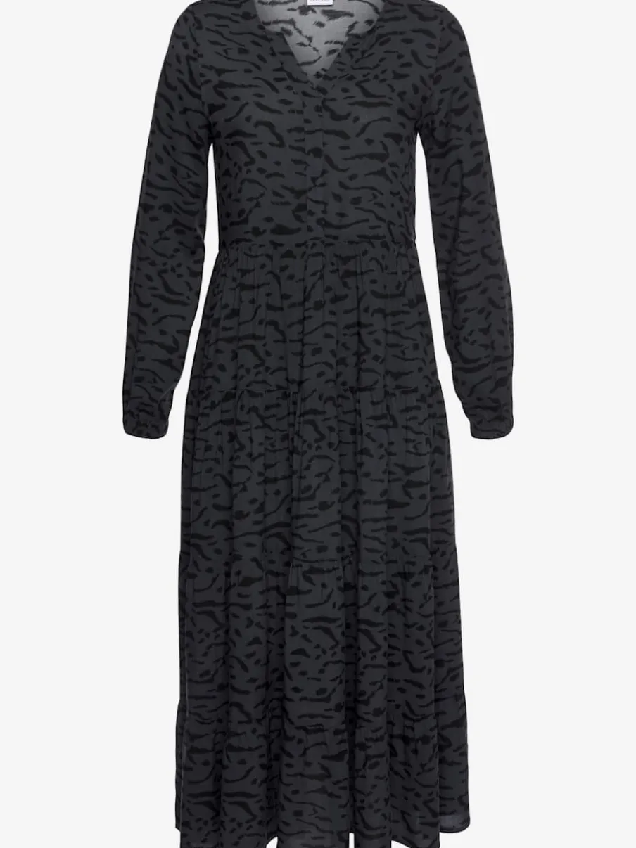 Robe longue avec encolure en v et manches longues élastiquées à motifs imprimés.