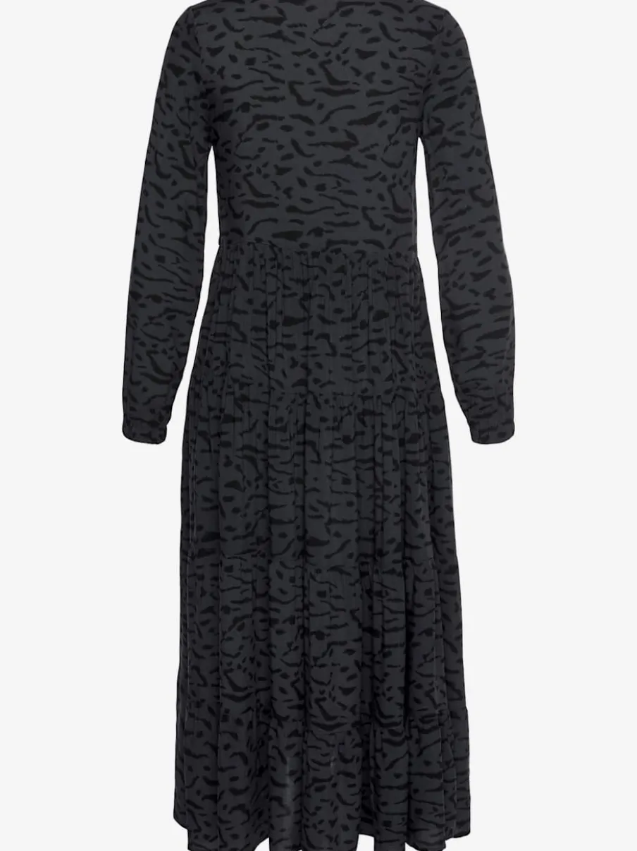 Robe longue avec encolure en v et manches longues élastiquées à motifs imprimés.