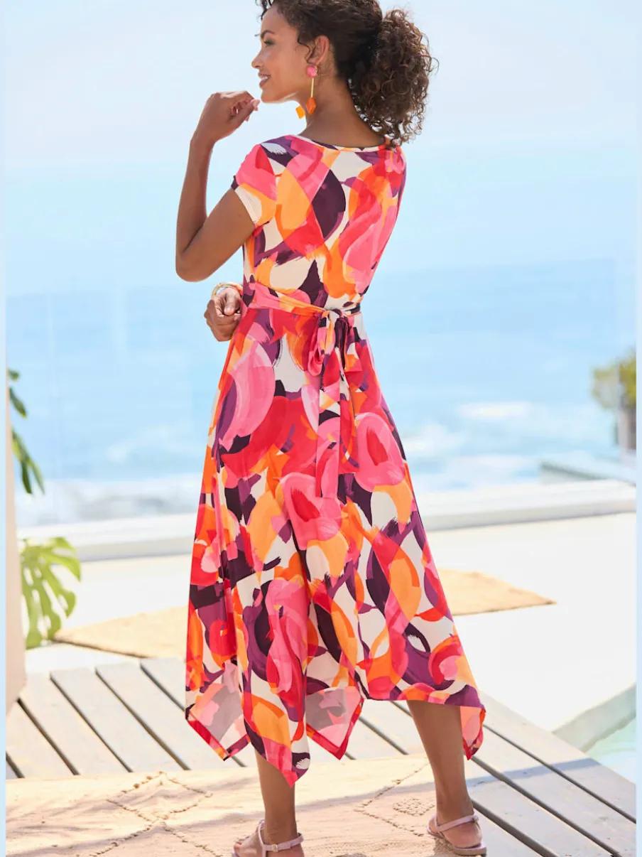 Robe mi-longue col chevauchant avec ceinture et ourlet asymétrique